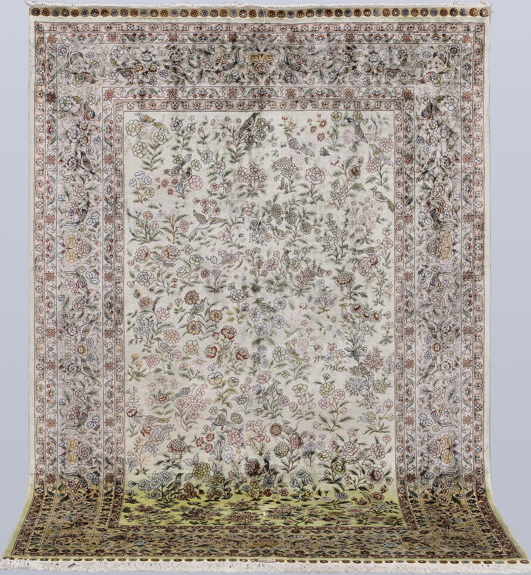 An Oriental silk rug, approx. 124 x 183 cm.