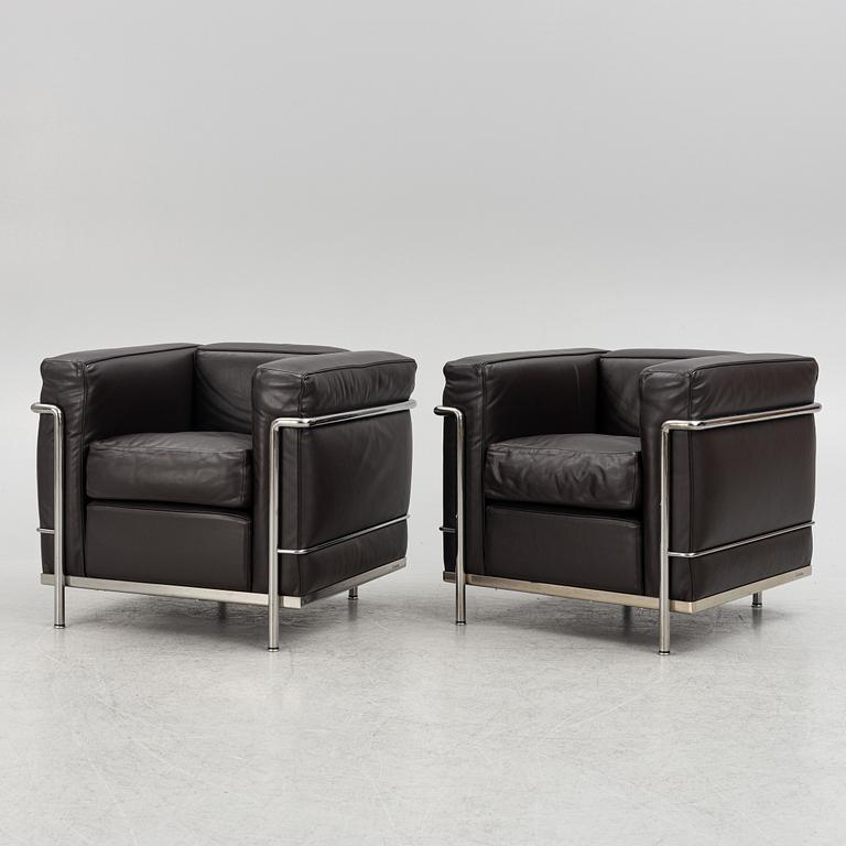 Pierre Jeanneret, Charlotte Perriand & Le Corbusier, a pair of 'LC2' armchairs, Cassina, Italy.