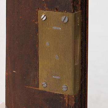 A long-case clock, England, 19th century.