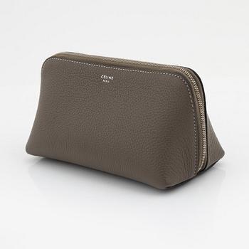 Céline, A small cosmetic pouch in beige leather.
