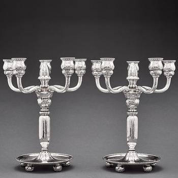 Georg Jensen, a pair of 830/1000 silver five light candelabra, Copenhagen 1920, design nr 200.