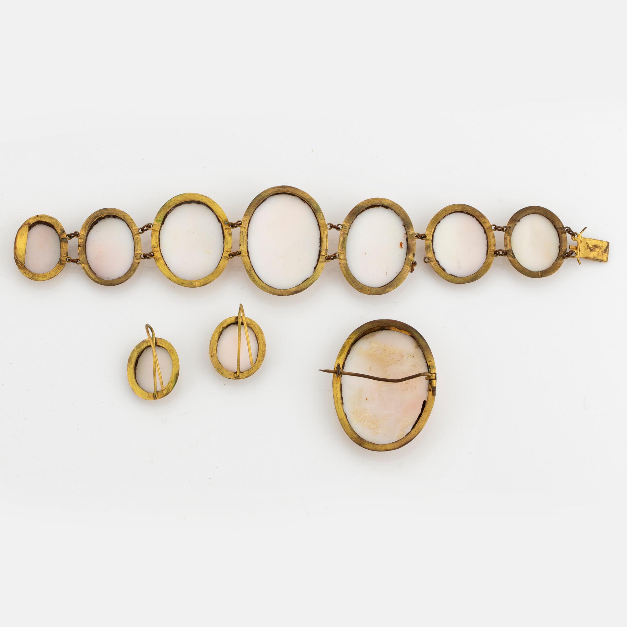 Set with brooch, earrings, bracelet with carved sea shell cameos.
