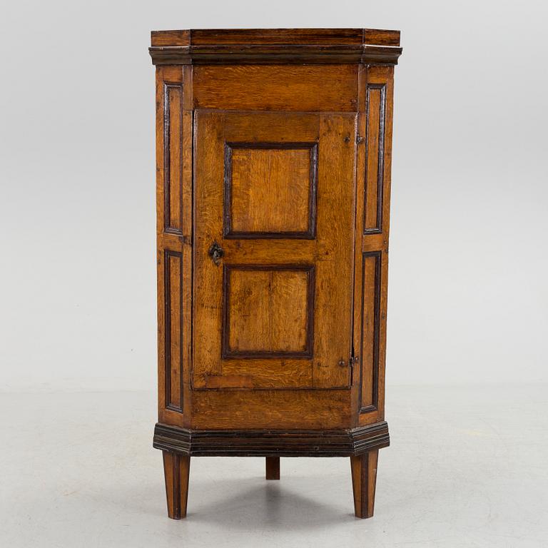 An 18th century corner cabinet.