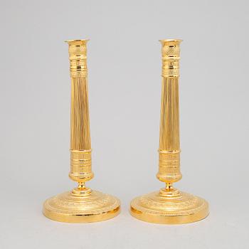 A pair of french Empire candlesticks, first half of the 19th Century.