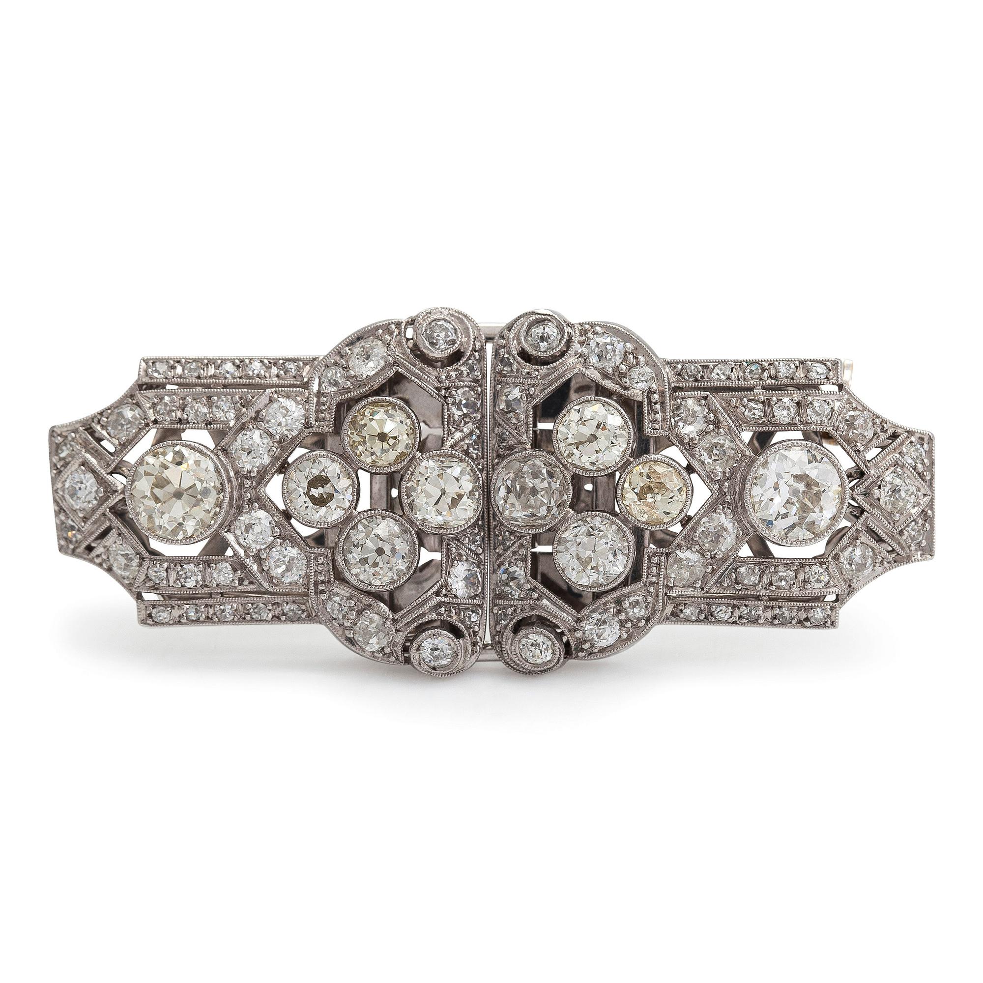 A 14K white gold Art Deco double clip brooch with old-cut diamonds approximately 4.90 cts in total. Austrian importmark.