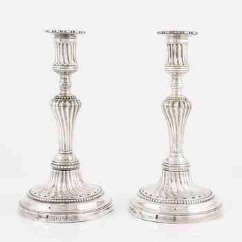 A pair of Louis XVI silvered brass candlesticks, possibly France, 18/19th century.