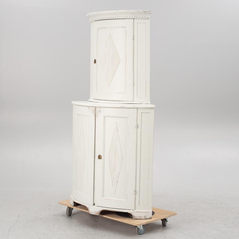 A two-part corner cabinet, 19th century.