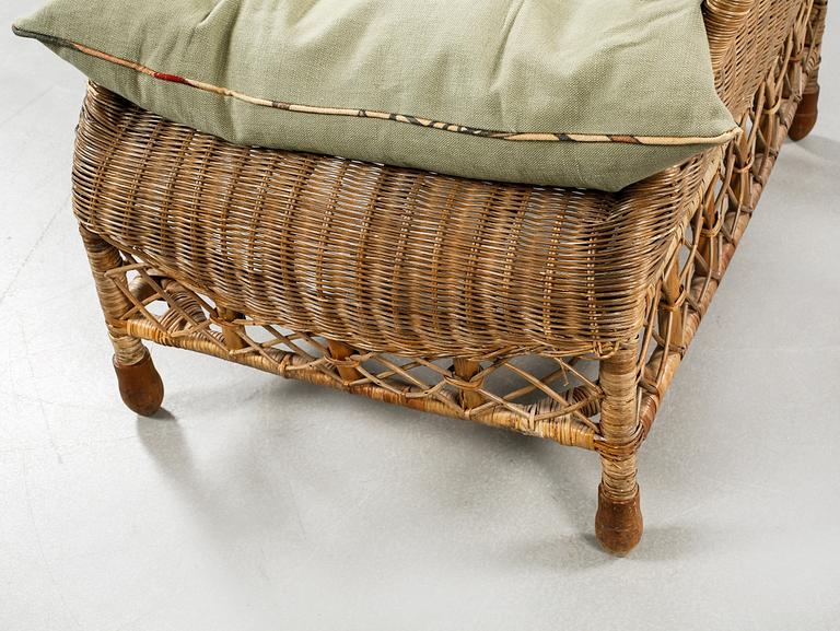 A rattan arm chair from the second half of the 20th century.