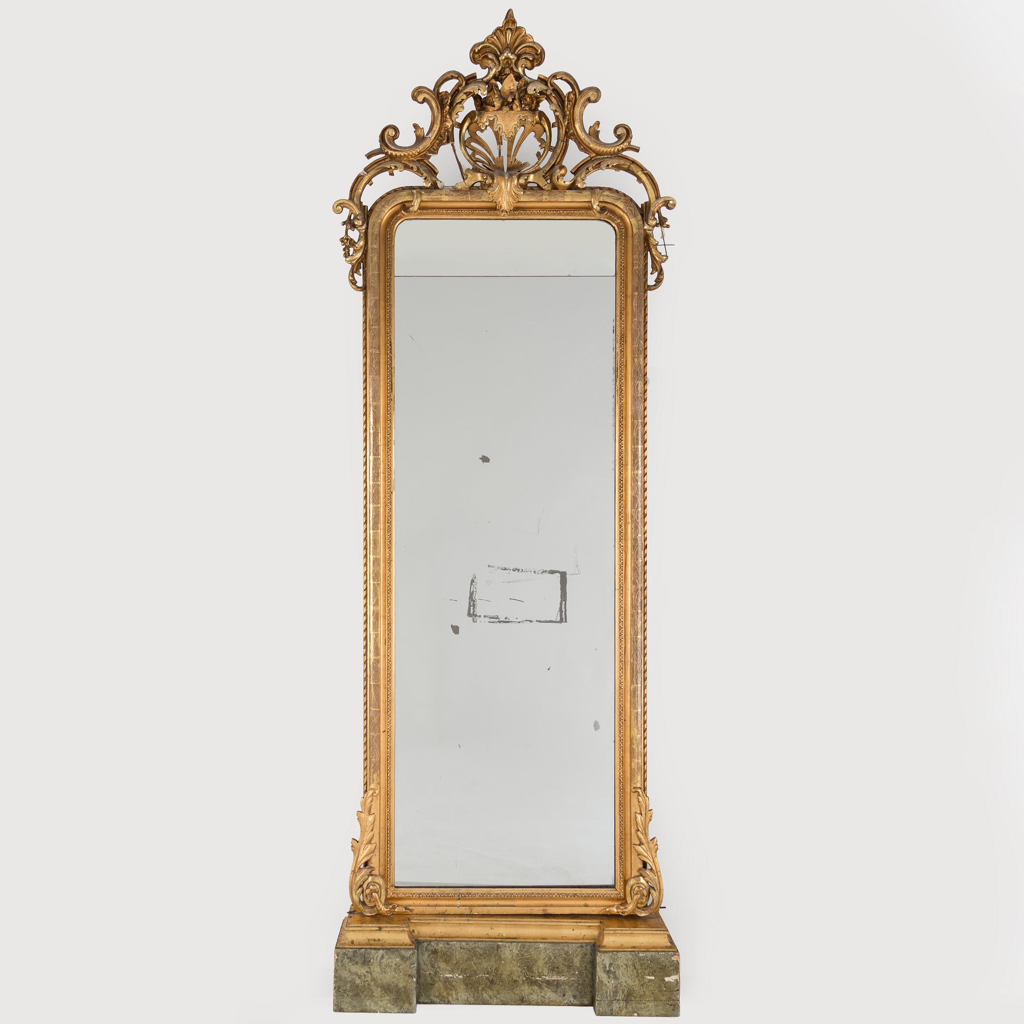 An early 20th century Rococo style mirror.