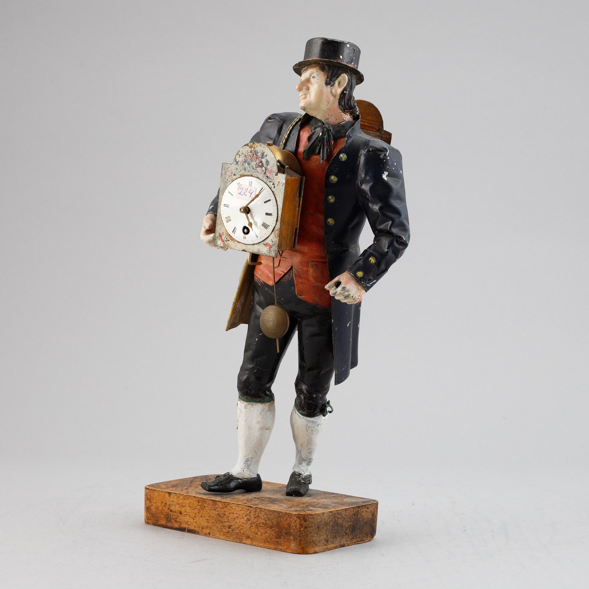 A Black Forest sheet metal figural timepiece, second half of the 19th century.