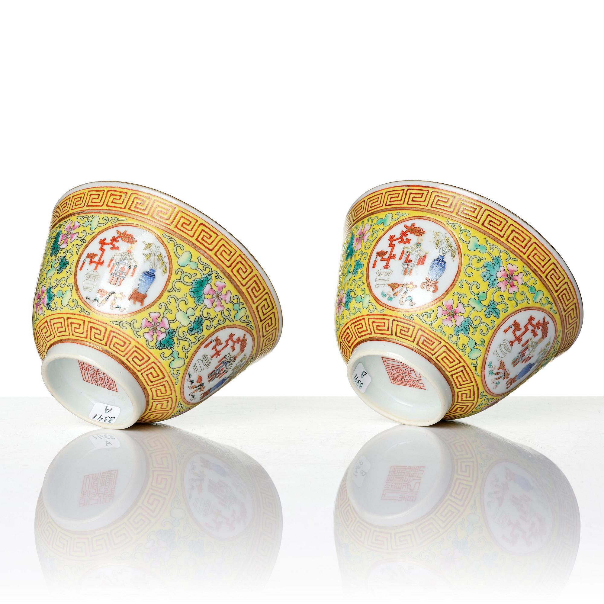 A pair of yellow ground 'medallion' bowls with covers, Qing dynasty with Daoguang mark.