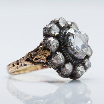 An 18K gold and silver ring with foil-backed rose-cut diamonds.