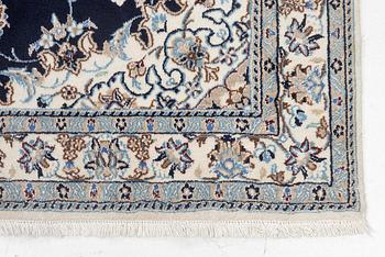 A Nain carpet, c. 255 x 150 cm.