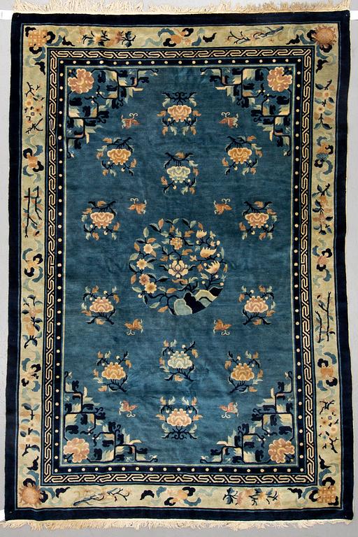 A CARPET, an old China, "antique finish", ca 270,5-273,5 x 181-186 cm (as well as ca 1 cm flat weave at the sides).