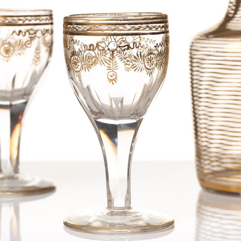 A set of six Russian glass goblets and a bottle with stopper, 19th Century.