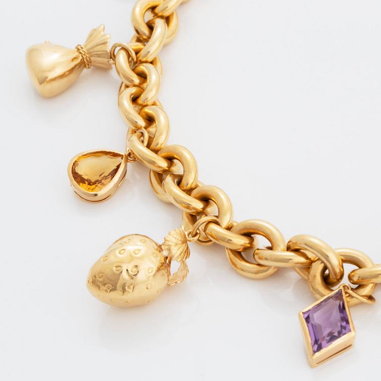 An 18k gold charm necklace.