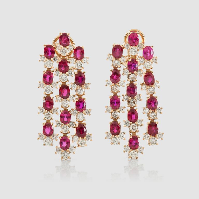 A pair of ocal-cut ruby and brilliant-cut diamond earrings. Diamonds total carat weight circa 3.70 cts.