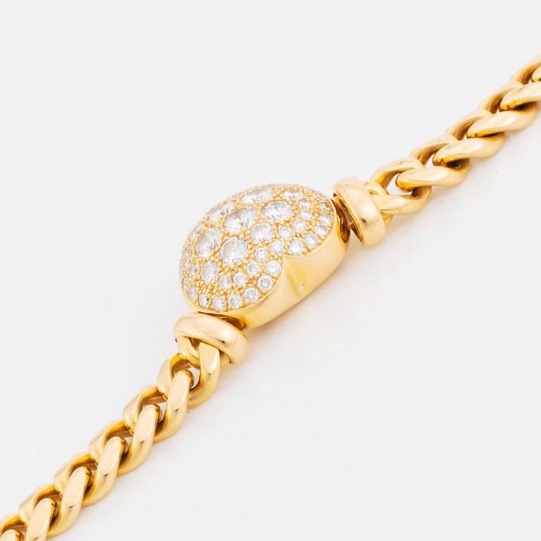 An 18K gold necklace set with round brilliant-cut diamonds.