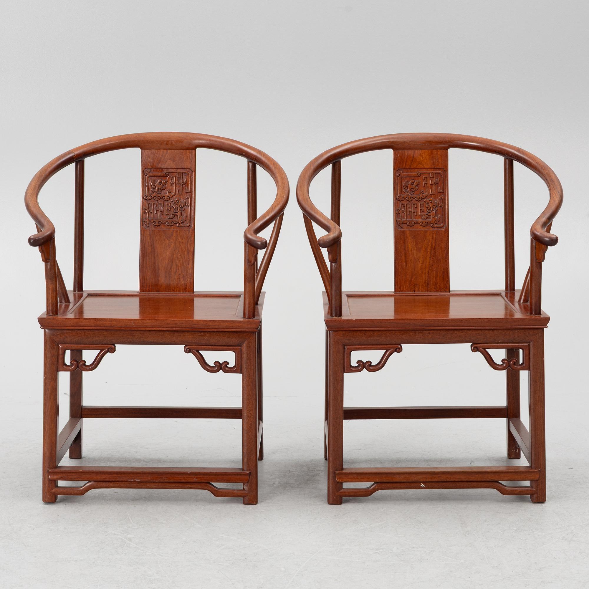 A pair of hardwood 'horse shoe back' hardwood armchairs, Hong Kong, 1960s.
