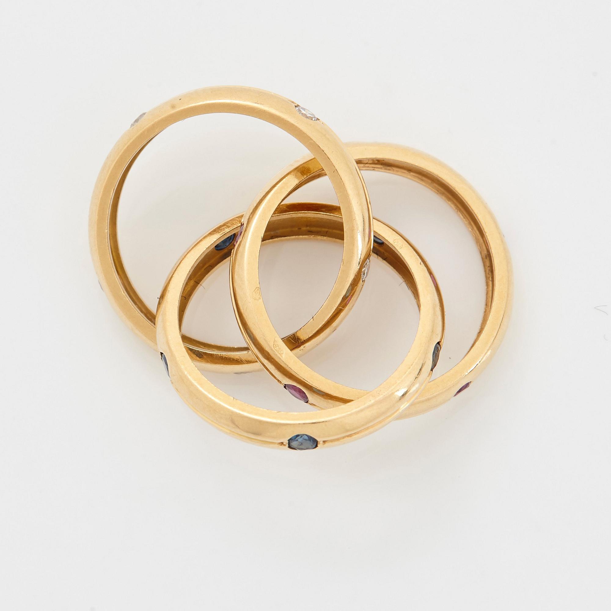 Cartier ring "Trinity" 18K guld med runda briljantslipade diamanter, rubiner och safirer.