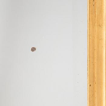 A mirror and console table from around the year 1900.