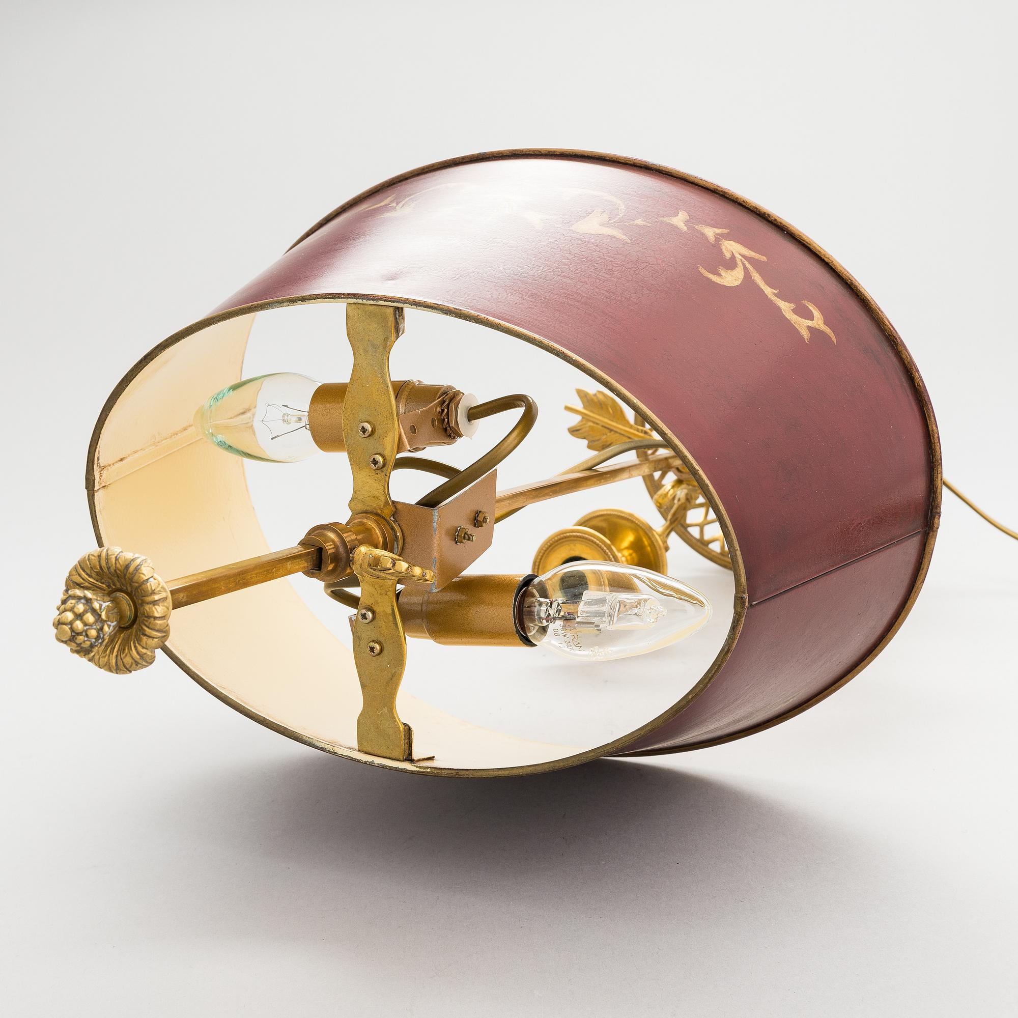 A gilt bronze bouillotte lamp for three candles, first half of the 20th century.