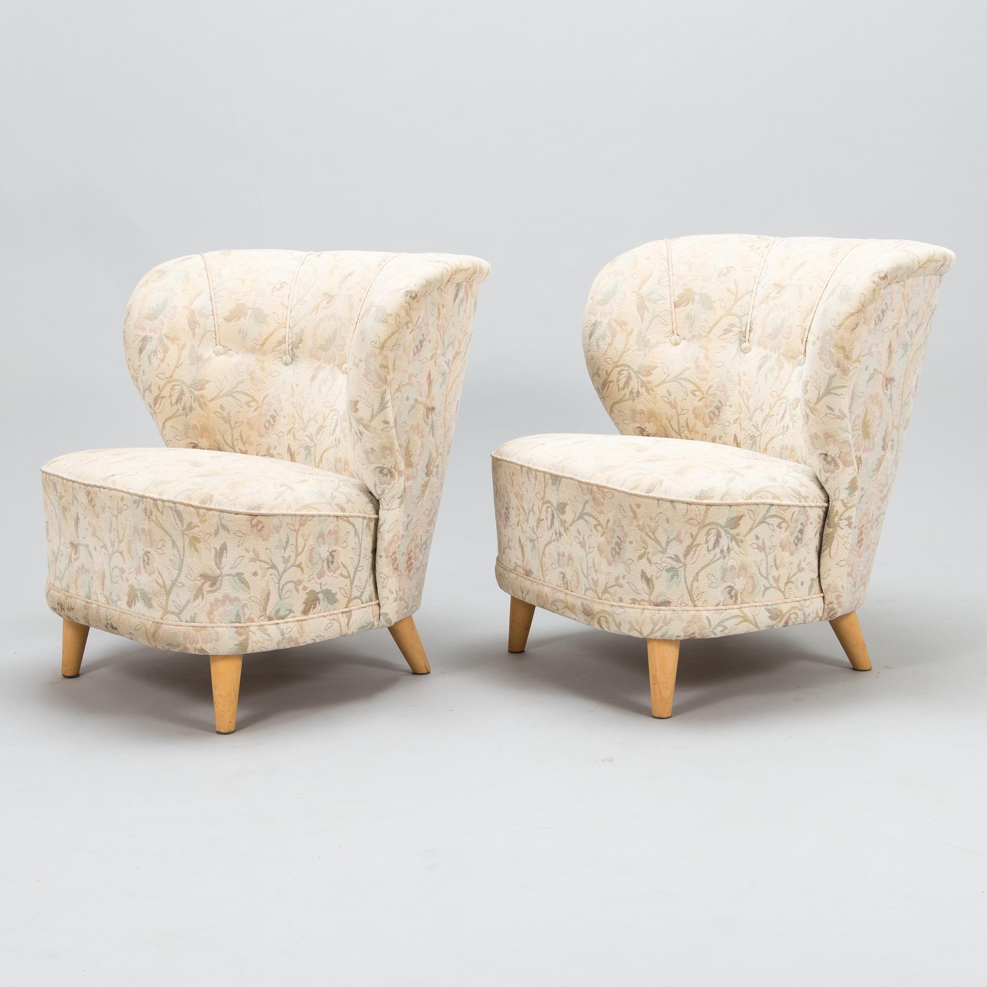 A pair of mid 20th century armchairs.