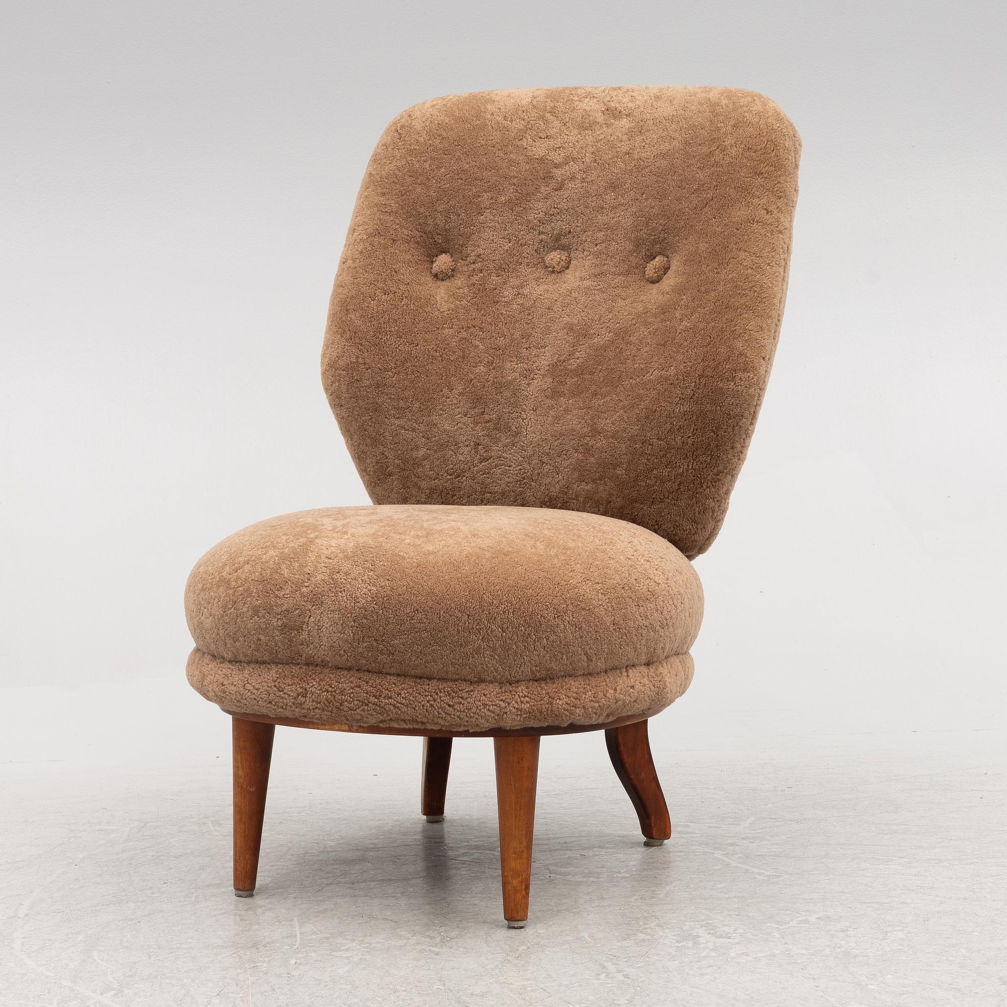 A mid 20th century easy chair,.