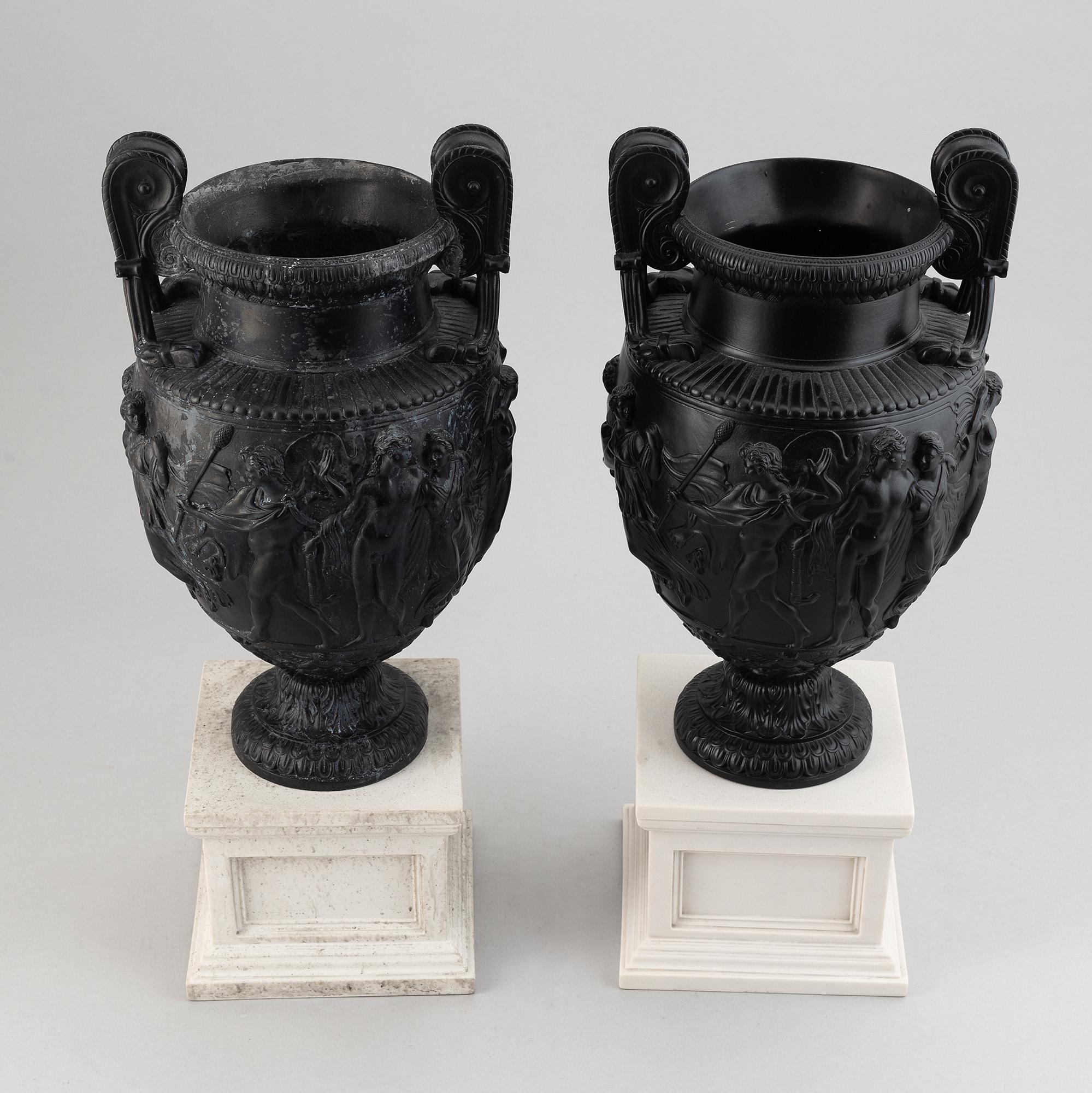 A pair of basalt ware volute vases, 19th century.
