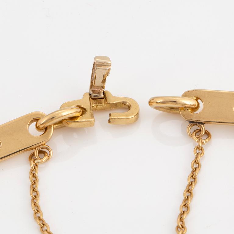 Cartier 18K gold charm bracelet.