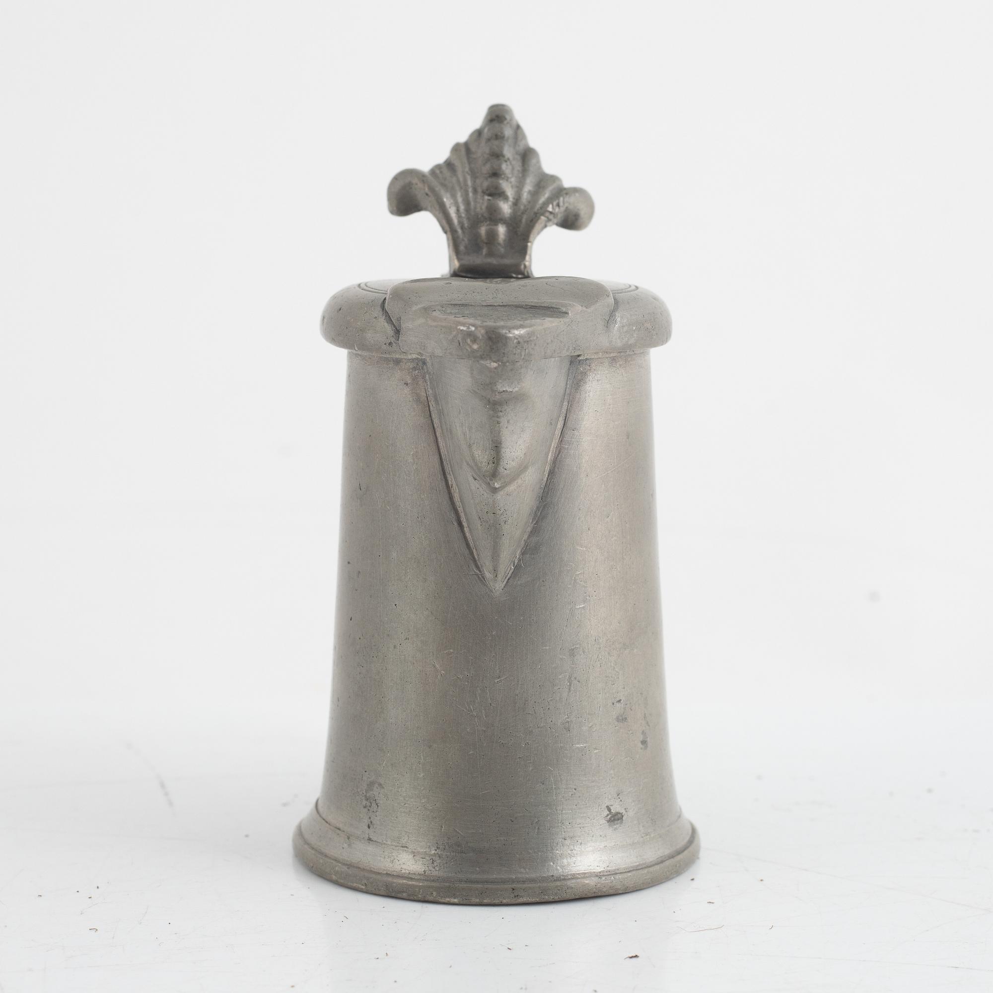 A pewter measuring cup by an unidentified master, dated 1766.