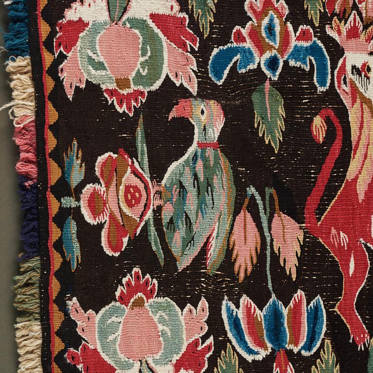 A CARRIAGE CUSHION, tapestry weave, ca 48-51,5 x 98-99 cm as well as fringes, Scania, Sweden, late 18th century.