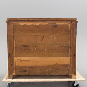 A late empire chest of drawers, mid 19th century.