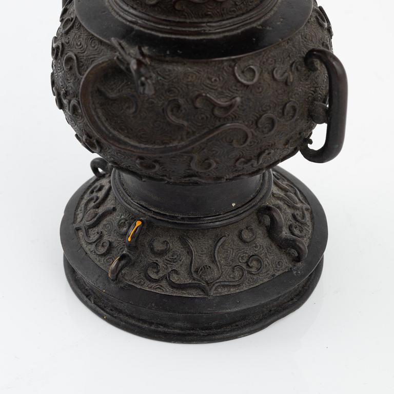 A Japanese bronze vase and censer with cover, Meiji period (1862-1912).