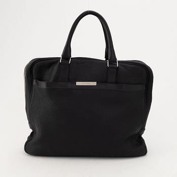 Christian Dior, a black leather briefcase.