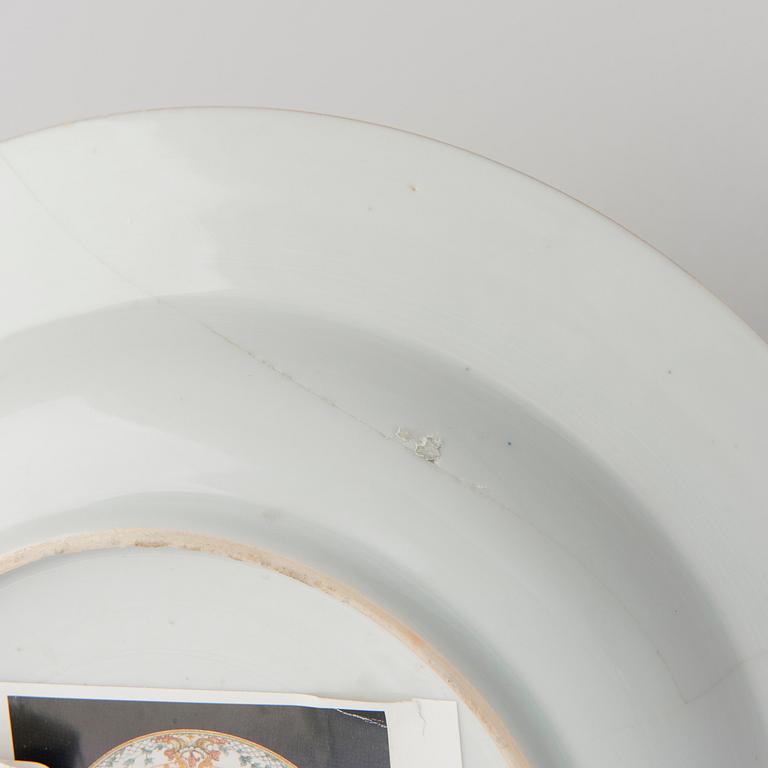 A CHINESE SOUP PLATE, amorial procelain. Qing dynasty, Qianlong (1736-95).