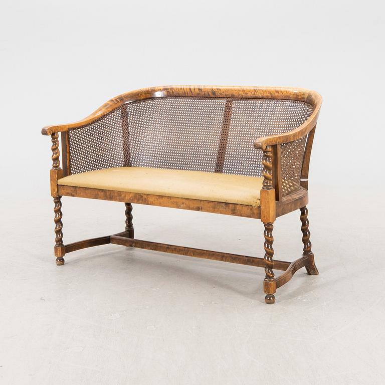 A 1920s rattan sofa.