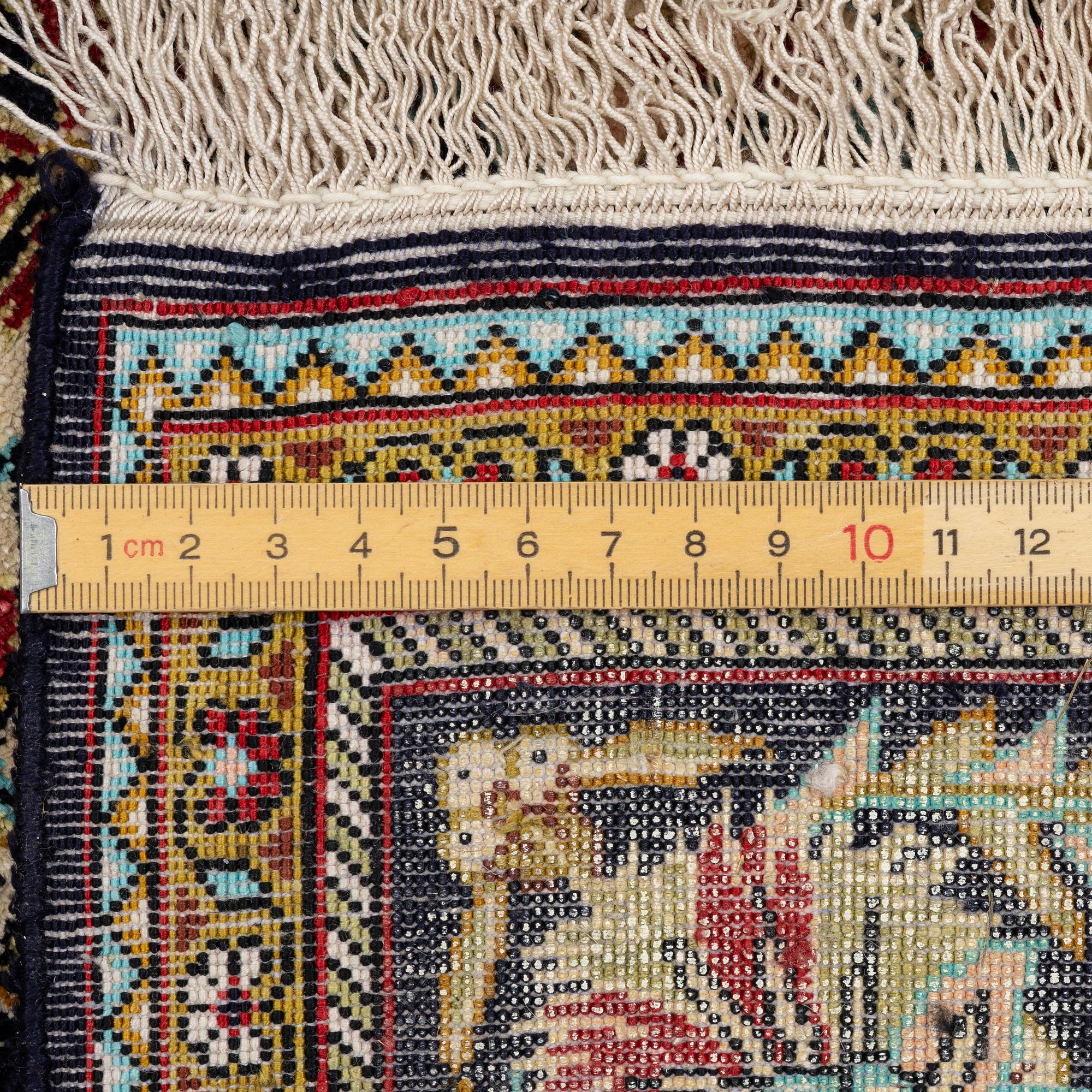 A silk Gohm rug. a 166 x 105 cm.