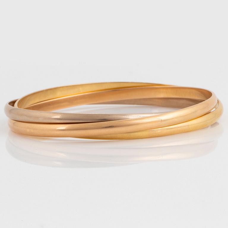 A Cartier "Trinity" bangle.