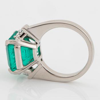 A platinum ring set with a Colombian emerald weight ca 10.40 cts.