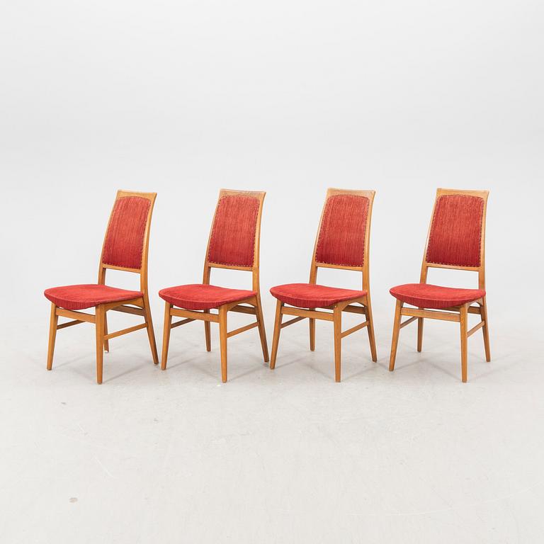A set of four  mid 1900s teak chairs.