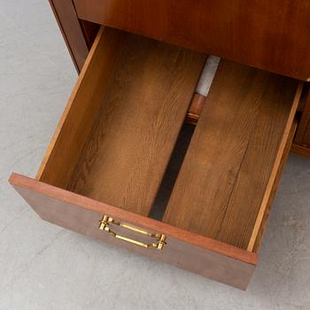 A mid 20th Century mahogany veneered  desk.