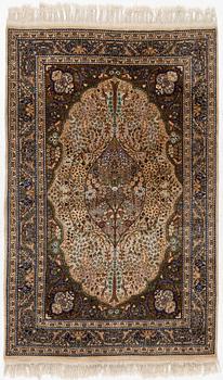 A Tabriz rug, a. 214 x 137 cm.
