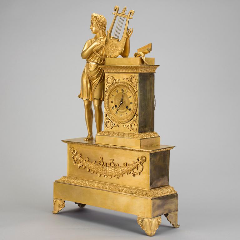 A French gilt bronze Empire mantle clock, early 19th Century.