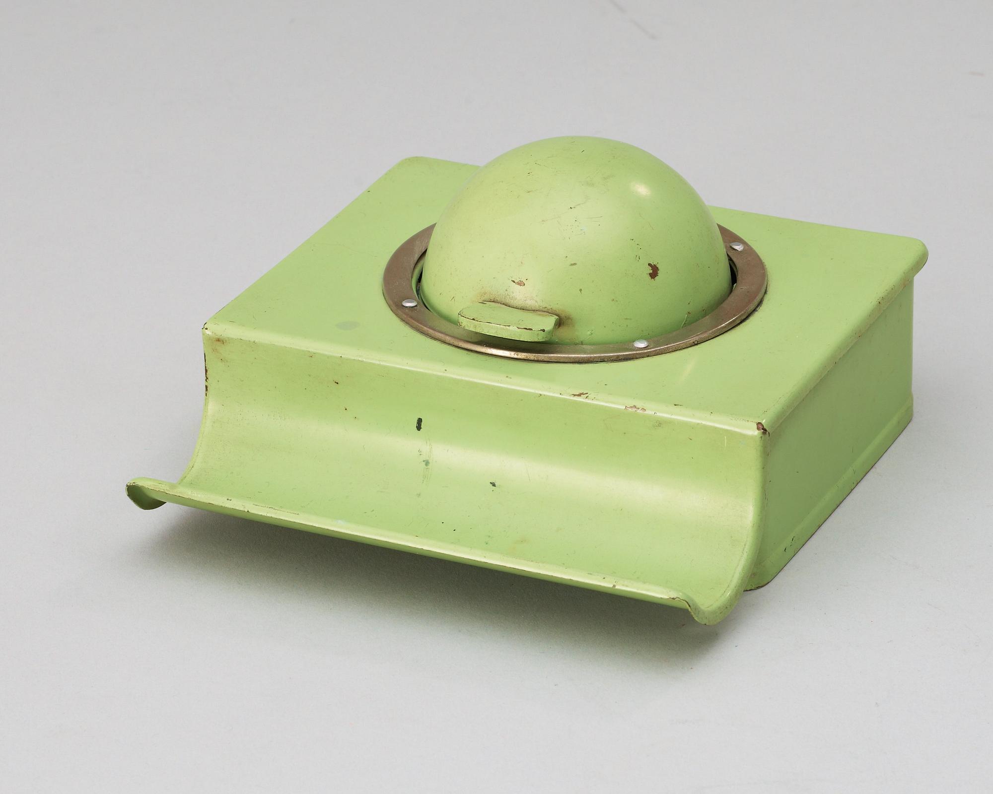 A Marianne Brandt enameled metal inkstand, a stamp dryer, and a bookend, Ruppelwerk, Gotha, Germany 1930's.