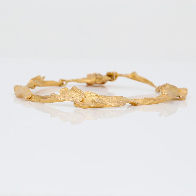 ARMBAND, guld 14K, "Orchid Psychedelic", Björn Weckström, Lapponia 1971. Vikt ca 13 g.