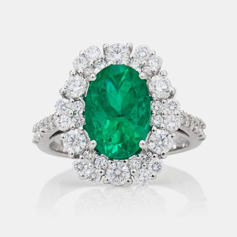 A 3.32ct Colombian emerald 'minor oil' and brilliant-cut diamond ring.