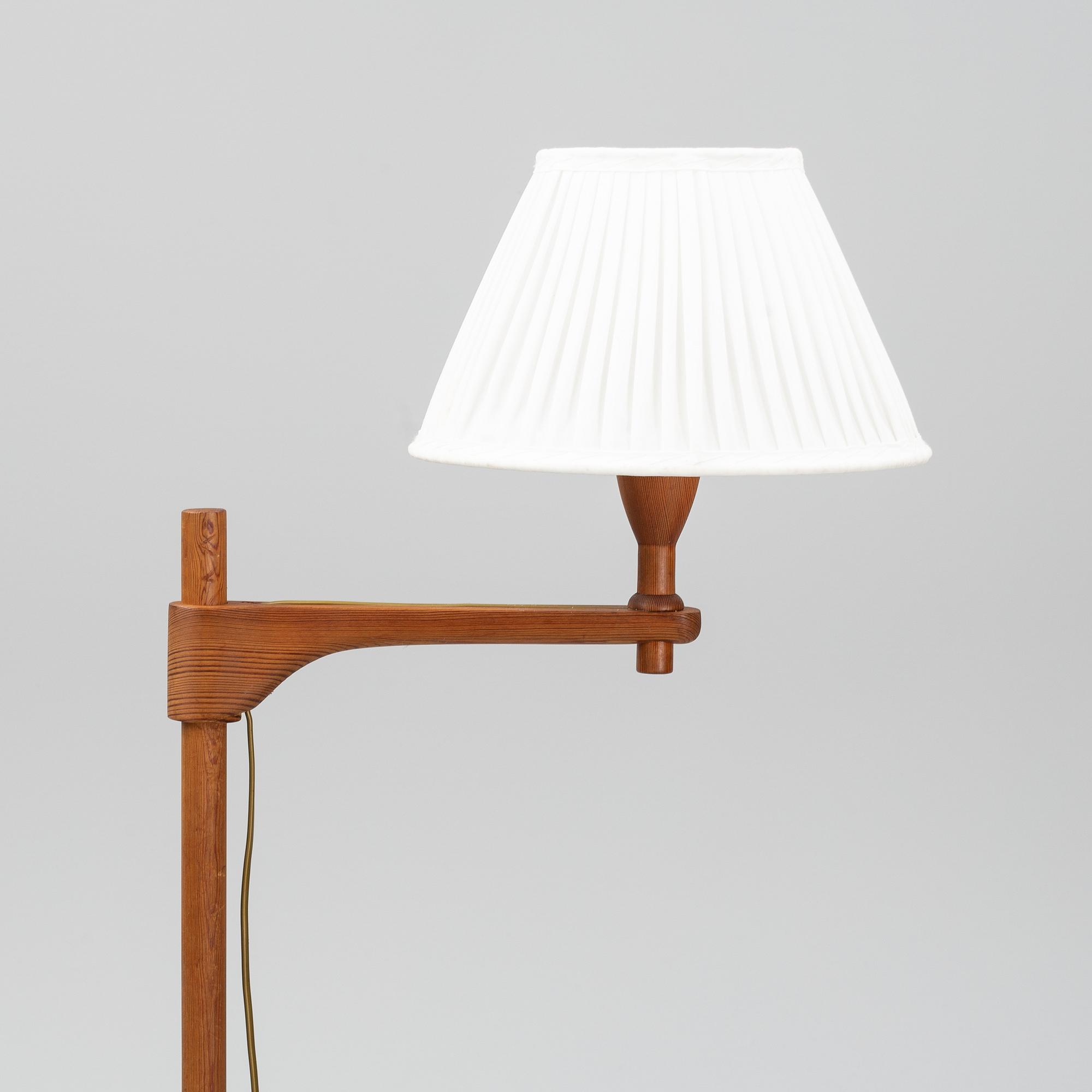 A late 20th century pine wood floor lamp design Carl Malmsten, Sweden.