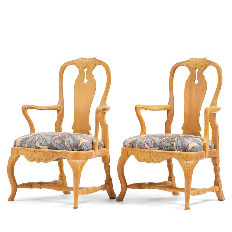 A pair of rococo open-back armchairs, Stockholm, later part 18th century.