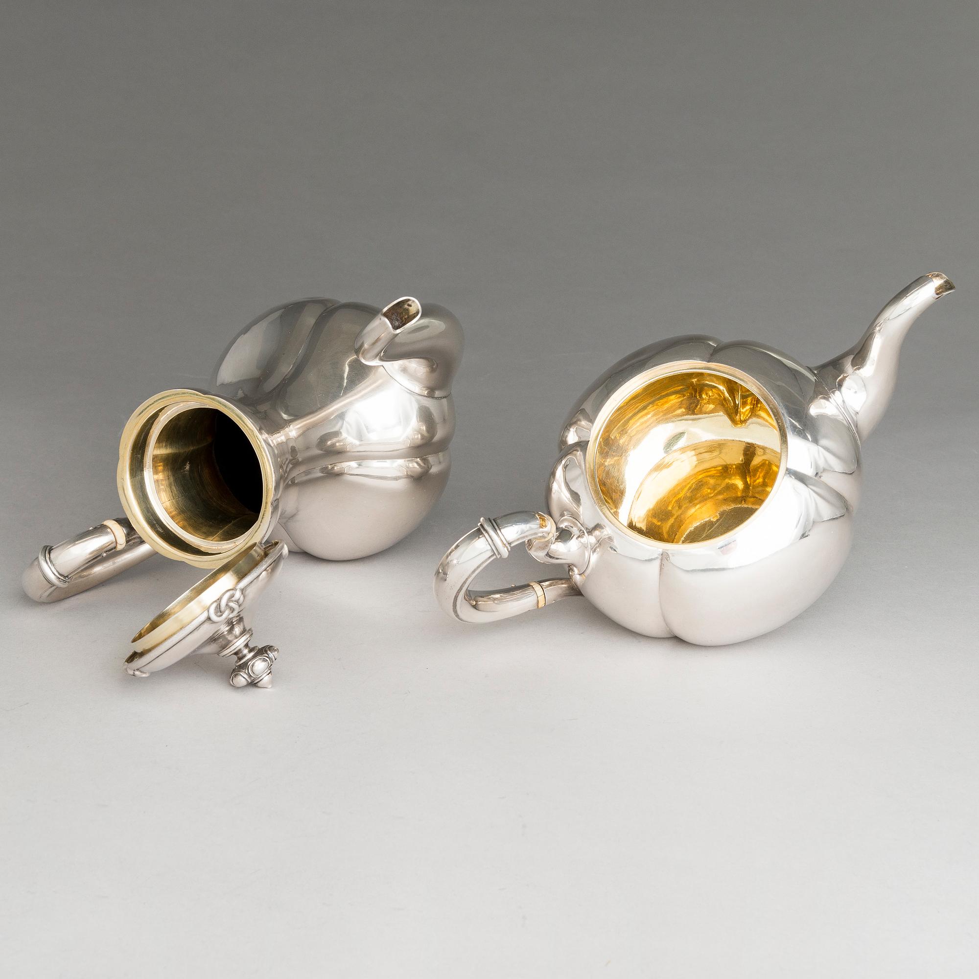 SAZIKOV, A 5-piece silver coffee and tea set, mark of the Sazikov Firm, Imperial Warrant, Saint Petersburg 1860.